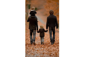 As they walk through the autumn, a Person Photo by ZinetroN