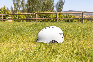 A white helmet on the green grass