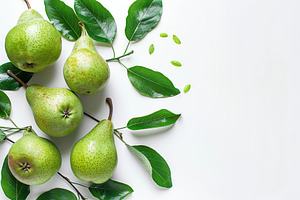 Green pears with leafs and copyspace for text on white background, a Food & Drink Photo by AlyaAnd