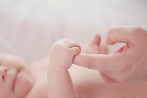 Newborn baby and parent