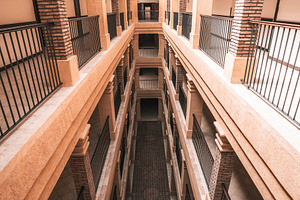 Symmetrical corridor with sunlight, an Architecture Photo by SkyNext