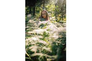 Woman Among Forest Ferns in Sunlight, a Person Photo by Jan Jack Russo Media