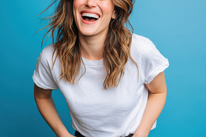 Joyful Woman Laughing on blue background, a Person Photo by AlyaAnd