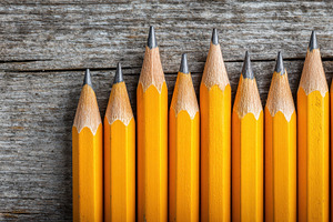 Ten yellow pencils lined up, a Photo by Pavel_design