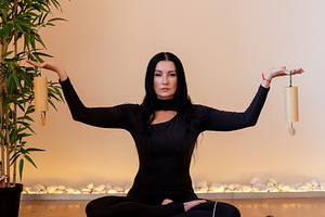 Mindfulness session retreat harmony female chime, a Person Photo by Photo Drive Studio