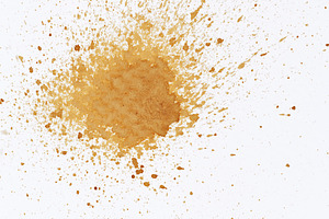 A large stain and small splashes of coffee on white paper, an Abstract Photo by ndanko