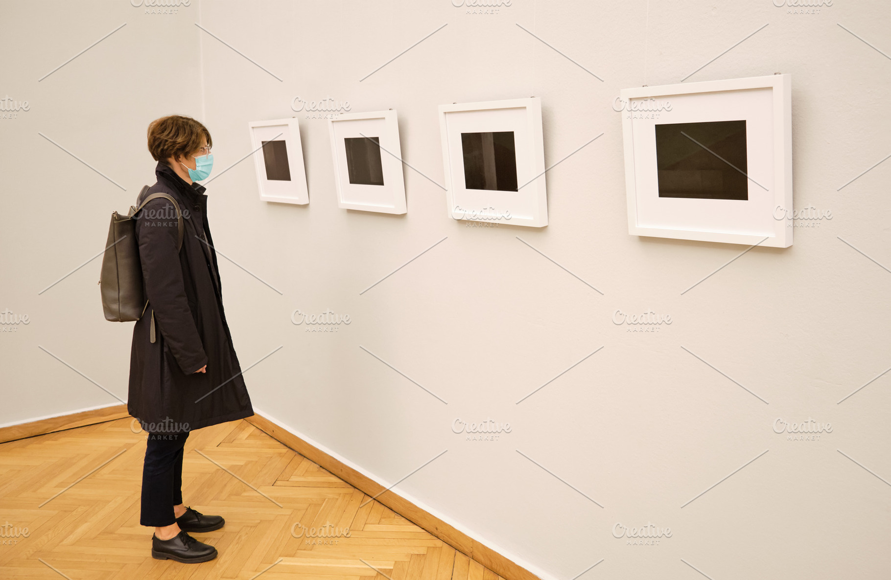 Woman with face mask in art gallery, a Health & Medical Photo by BOOCYS