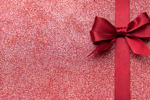 Red glitter background with ribbon bow wrapping concept, a Holiday Photo by Olena Rudo