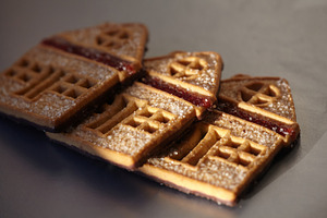 Sweet house-shaped cookies decorated with sugar and red fruit jam., a Food & Drink Photo by Rohan Photography