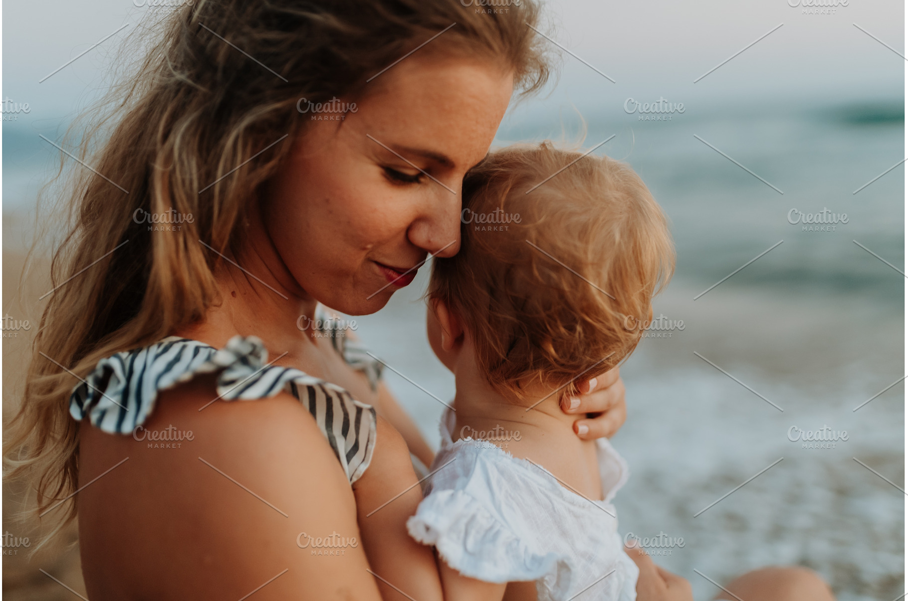 Tender moment between young mom and, a Person Photo by HalfPoint