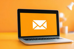 Laptop displays vibrant mail icon, a Photo by Pavel_design