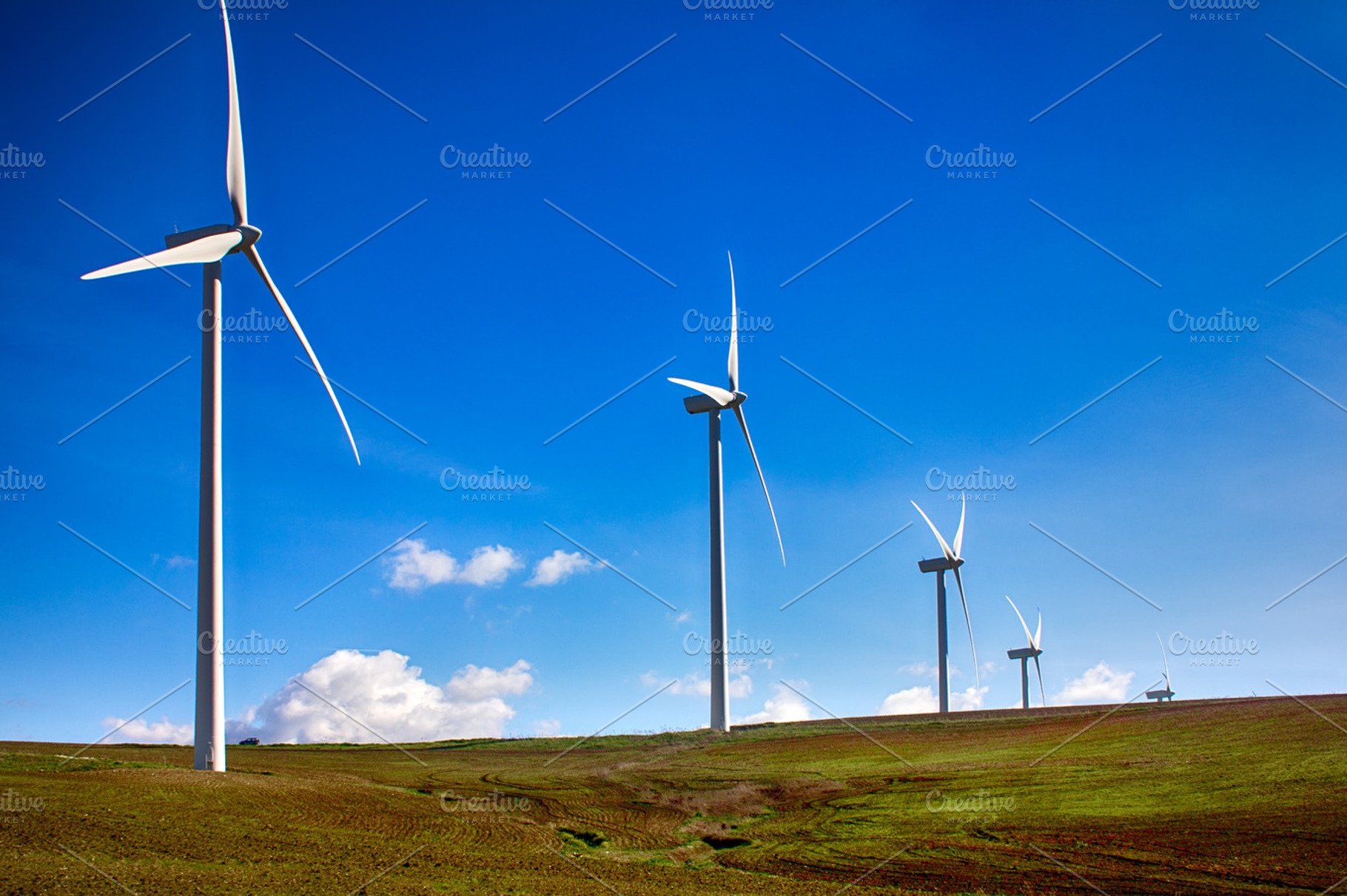 Windmills on green meadow spain stock photo containing alternative and, a Technology Photo by CARLOSANDESTHER