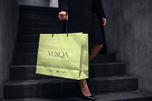 Paper Shopping Bag Mockup with Model, a Packaging Mockup by graphypix