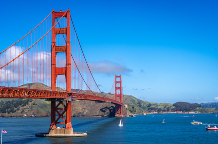 Golden Gate Bridge over blue waters with scenic hills in San Fra, an Architecture Photo by GoodGoods