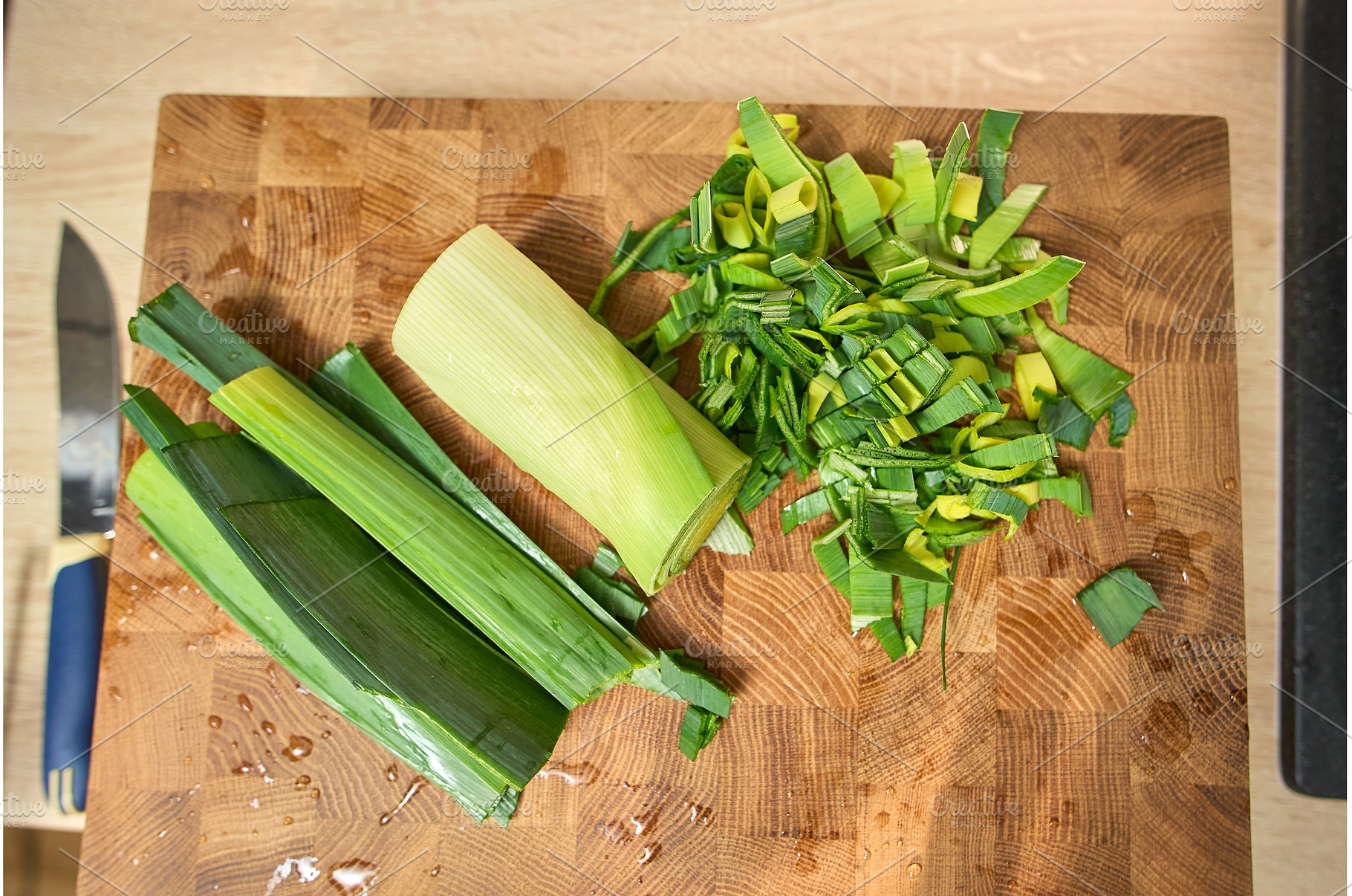 Chopping leeks on a wooden cutting, a Food & Drink Photo by darksoul72