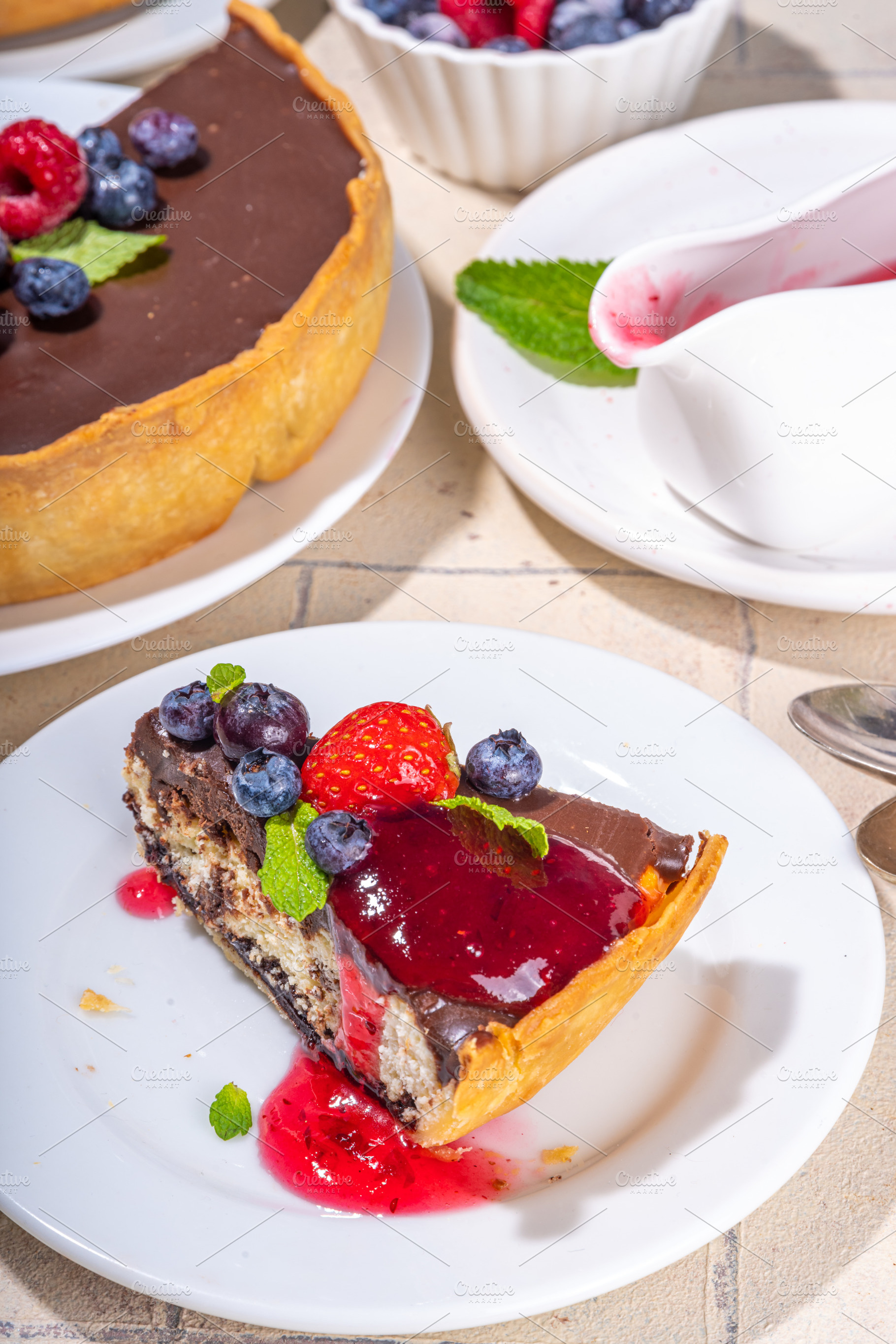 Homemade cheesecake with chocolate and berry, a Food & Drink Photo by Rimma