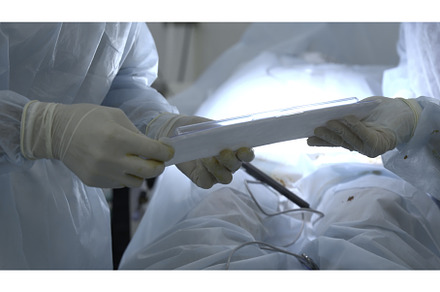 Nurse passing disposable sterile kit, a Health & Medical Photo by Media Whale Stock