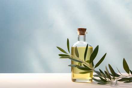 Bottle of olive oil and green olives with leaves on light background, a Food & Drink Photo by Natalia Klenova's Shop