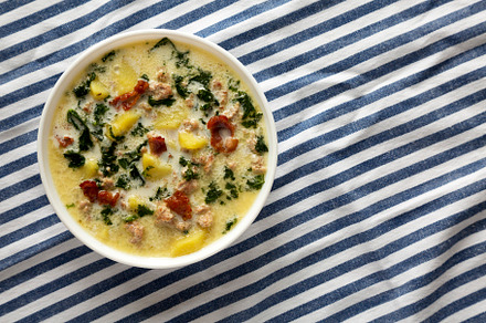 Homemade Zuppa Toscana with Kale and Bread in a white bowl, top, a Food & Drink Photo by LiudmylaChuhunova