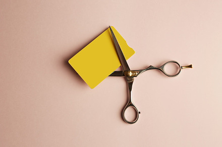 Mockup of yellow color credit card stock photo containing scissors and mockup