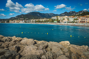 Seaside buildings and famous beach, an Architecture Photo by Alpine Dreams