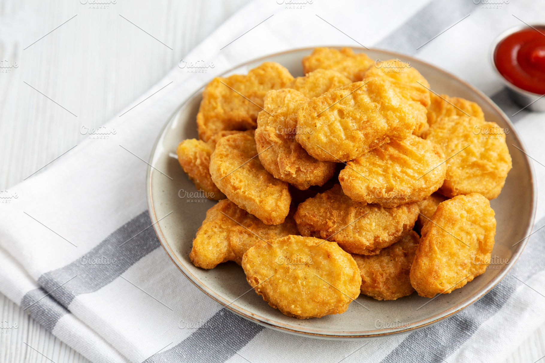 Homemade Chicken Nuggets with Ketchup, side view. Copy space., a Food & Drink Photo by LiudmylaChuhunova