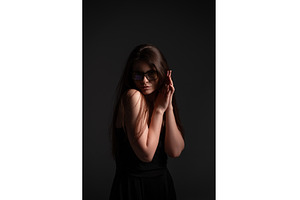 Woman posing wearing glasses, hands, a Person Photo by volodymyrshtun13795