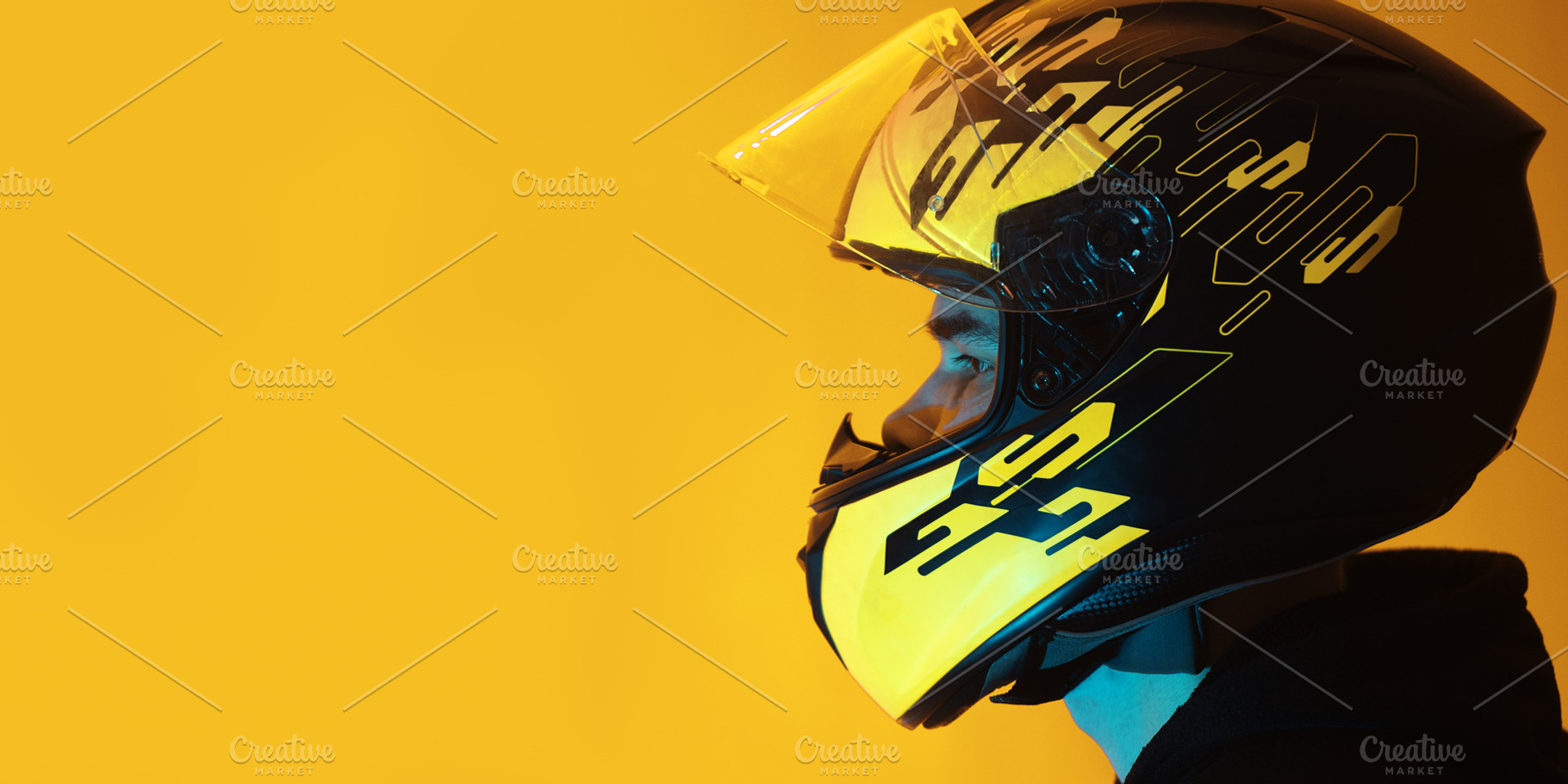 man in a helmet on a yellow background , copy space, a Person Photo by PavelKant