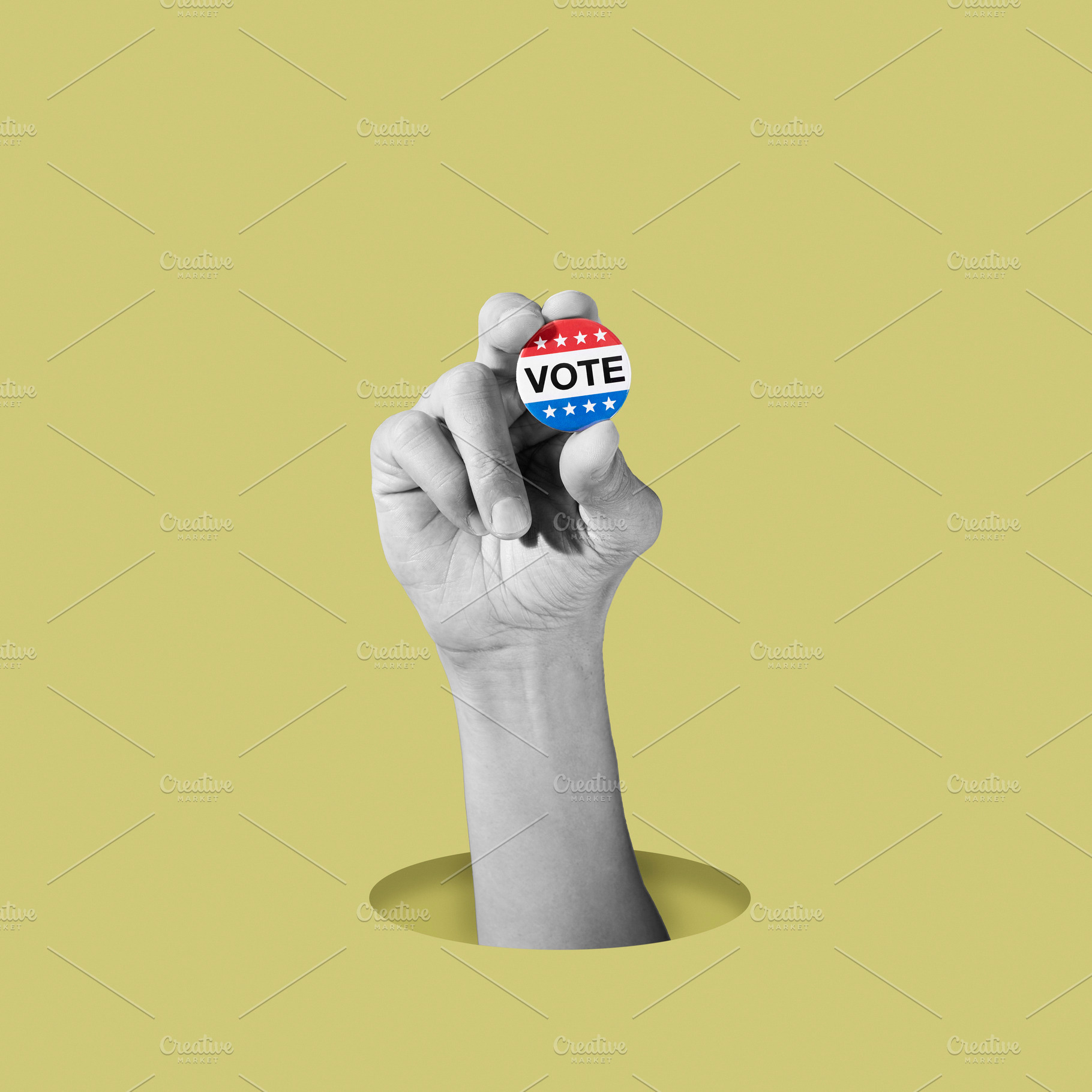black and white man holding a colorful vote badge, a Photo by Nito