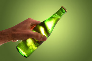 Cold Beer Bottle in Hand, a Food & Drink Photo by Davizro's Market