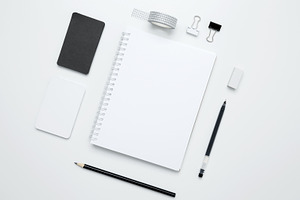 An empty mock up notebook, white and black cards, monochrome stationery items a, a Photo by matucha