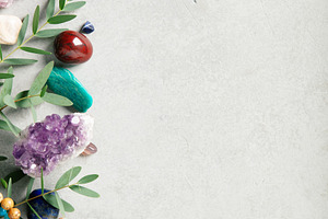 Healing Crystals and Green Leaves on Textured Concrete Backgroun, a Nature Photo by Natalia Klenova's Shop