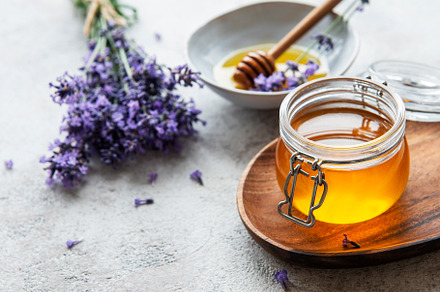 Jars with honey and fresh lavender flowers, a Food & Drink Photo by Olena Rudo