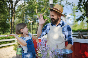 Father and young daughter planting, a Nature Photo by HalfPoint