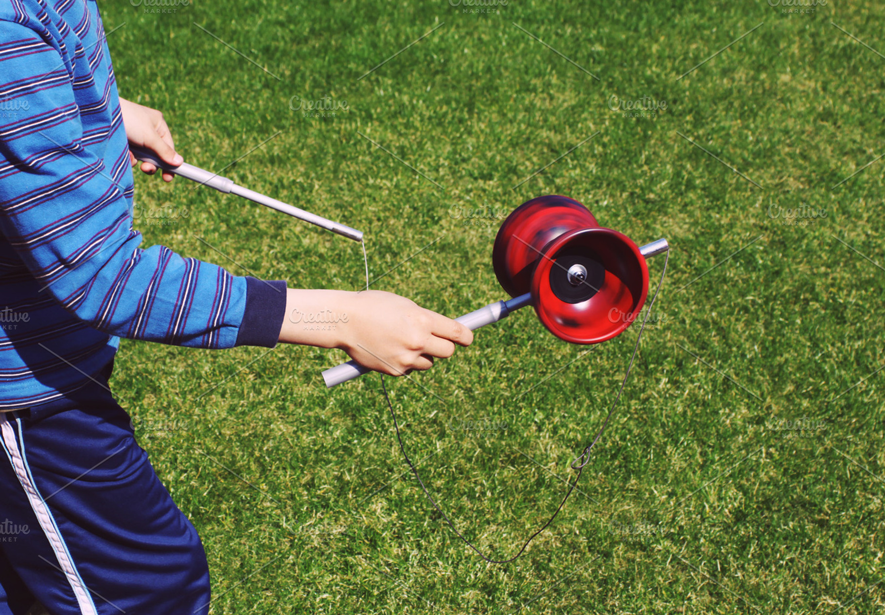 Boy playing diabolo, a Person Photo by BOOCYS