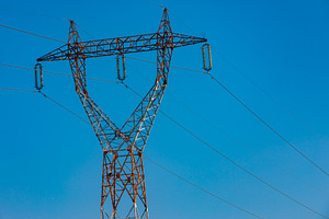 Tall metal electricity transmission tower with multiple power lines set against, a Technology Photo by Ales Munt