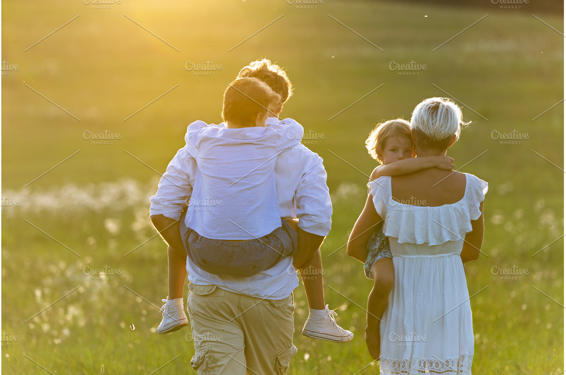 Rear view of family with two kids on, a Person Photo by HalfPoint