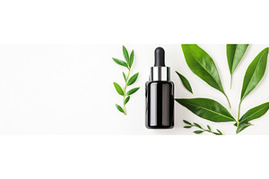 Black dropper bottle with green, a Beauty & Fashion Photo by Lermont51