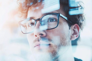 Young man with glasses looking up, s, a Photo by Dvoevnore photos