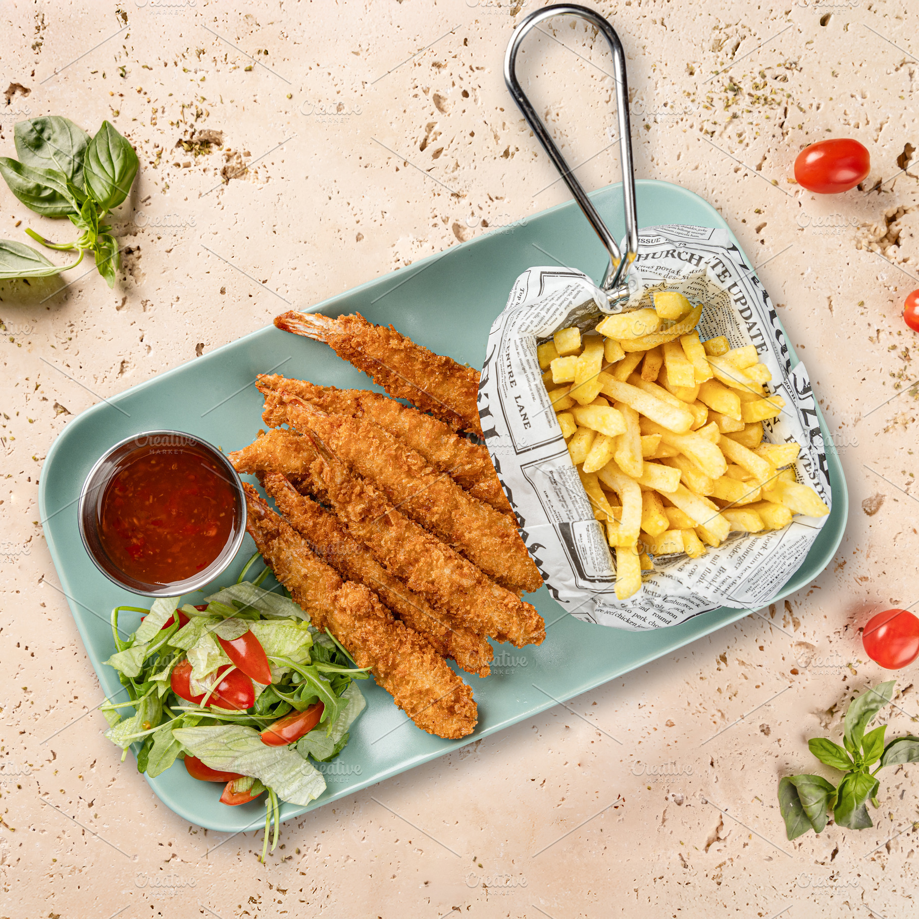 Breaded shrimps served with french fries, a Photo by Grafvision photography