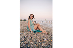 Woman in Flowing Dress on Seaside, a Person Photo by Jan Jack Russo Media