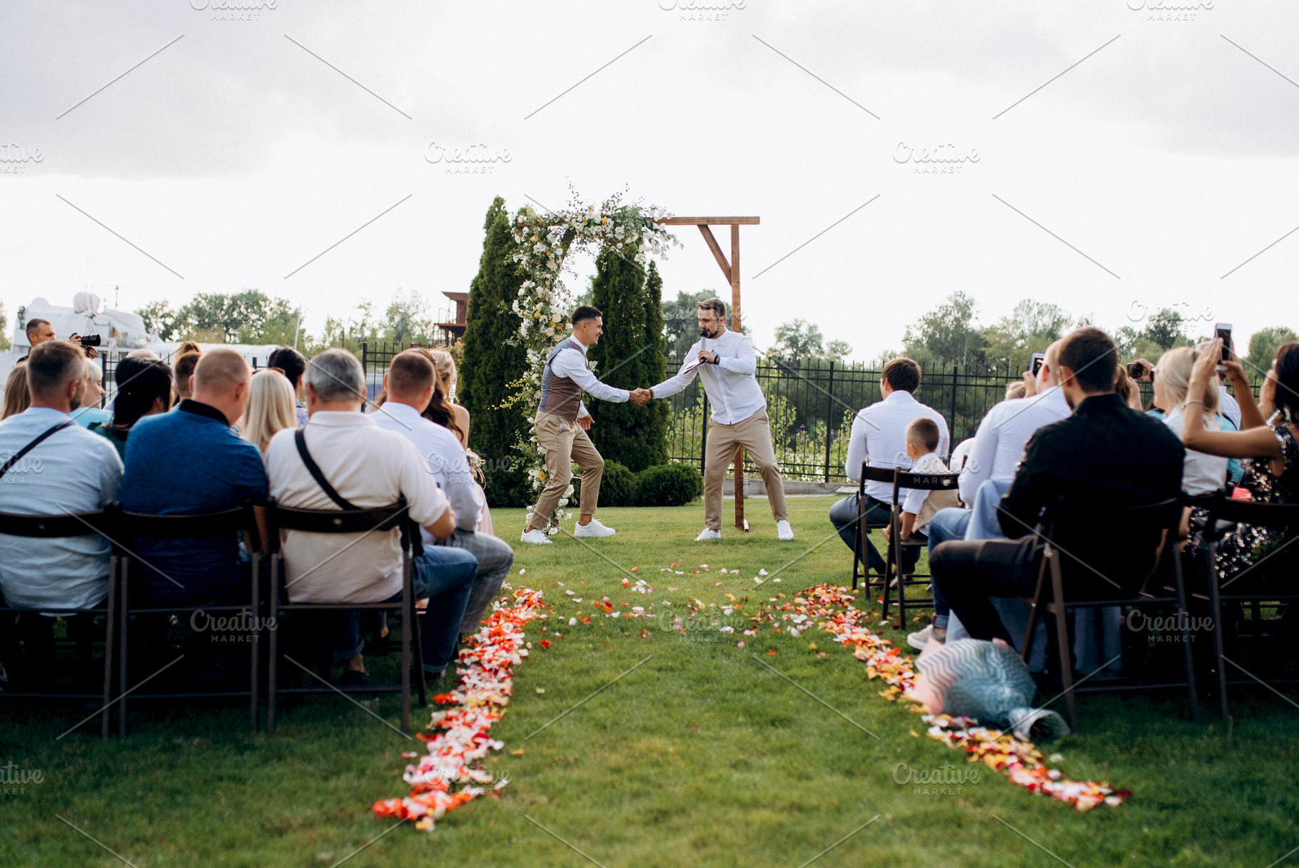 wedding ceremony of a young couple in love on a green meadow, a Photo by Weddings, People, Travel