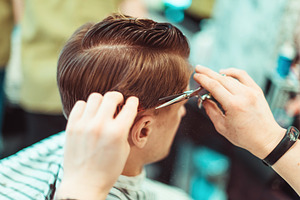 Men's beauty salon. Haircut closeup.
