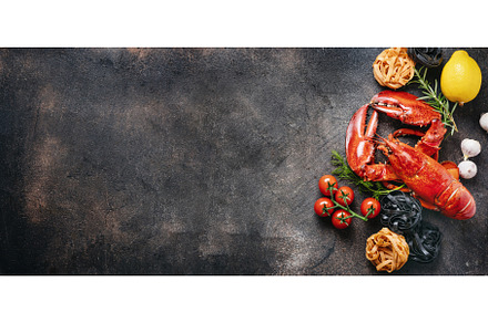 Red prepared lobster with pasta and, a Food & Drink Photo by Yummypic