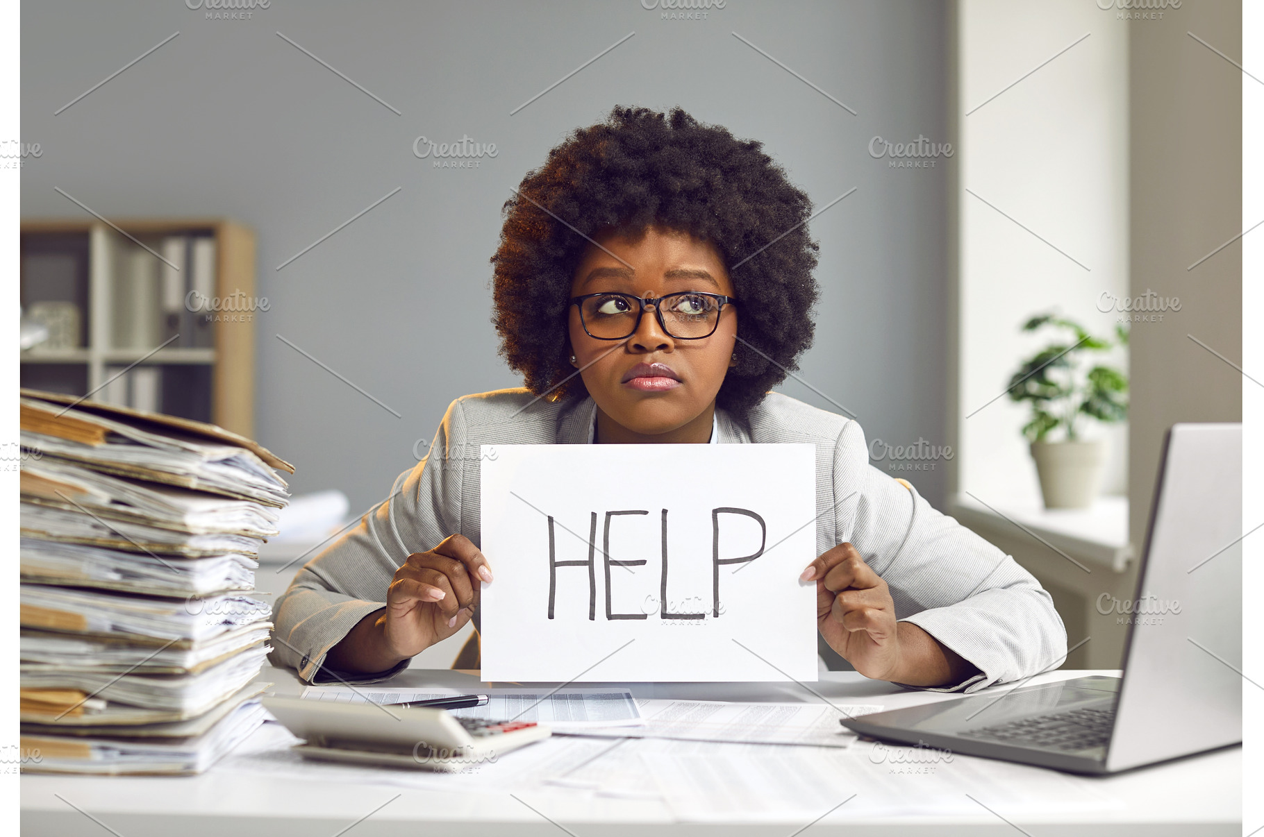 Tired woman sitting at desk at her, a Person Photo by StudioRomantic