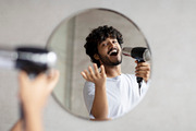 Playful indian guy holding hairdryer and singing as in microphone, doing mornin, a Photo by Prostock-Studio (Thumbnail 5 of 5)