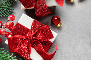 Christmas gifts and decorations on gray background, a Holiday Photo by Olena Rudo