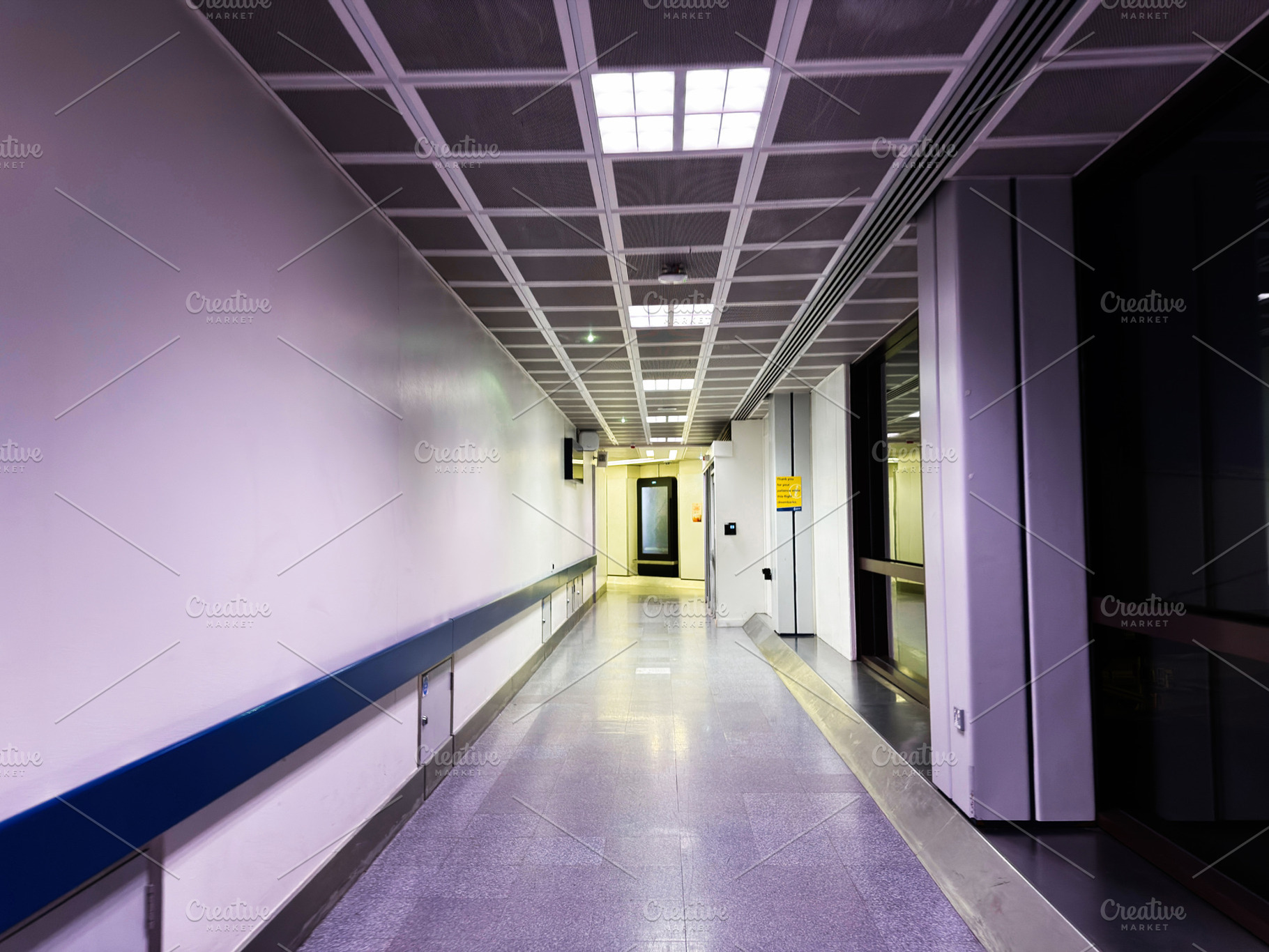 Empty modern airport corridor and terminal walkway in Manchester with reflectiv, a Photo by AS photostudio