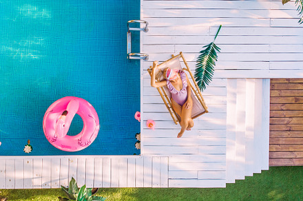 Top view young woman in swimsuit swi featuring top, view, and pool, a Holiday Photo by Maksym Zaitsev