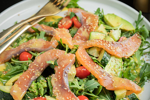 Salad with salted salmon and arugula, a Food & Drink Photo by Budarinphoto